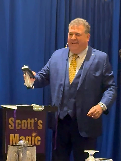 Scott the Magician performing his money shredding trick.